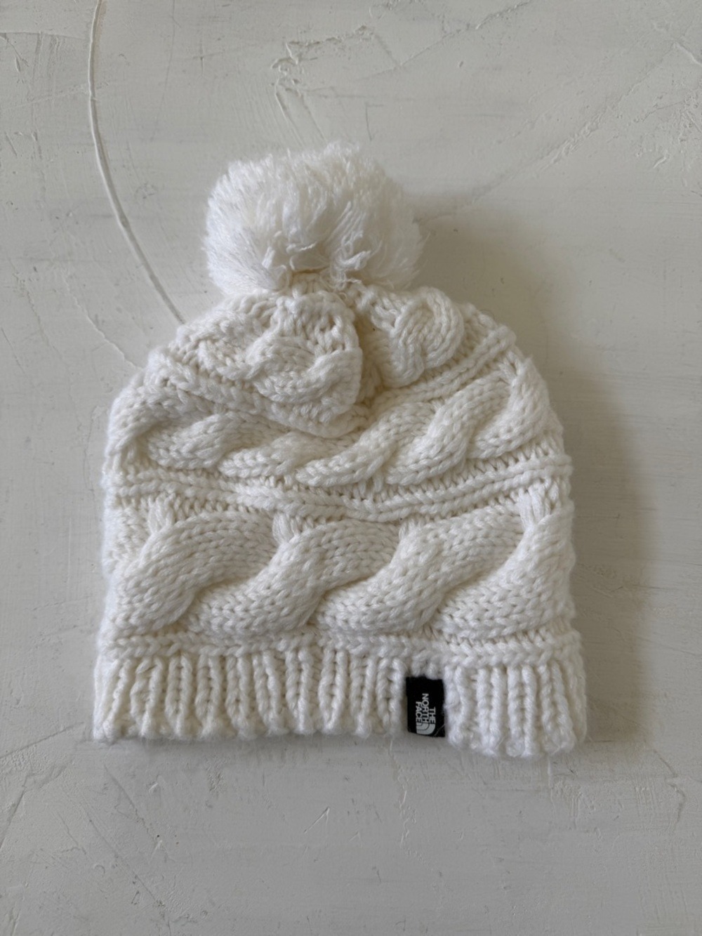 The North Face Cream Cable Knit Pom Beanie